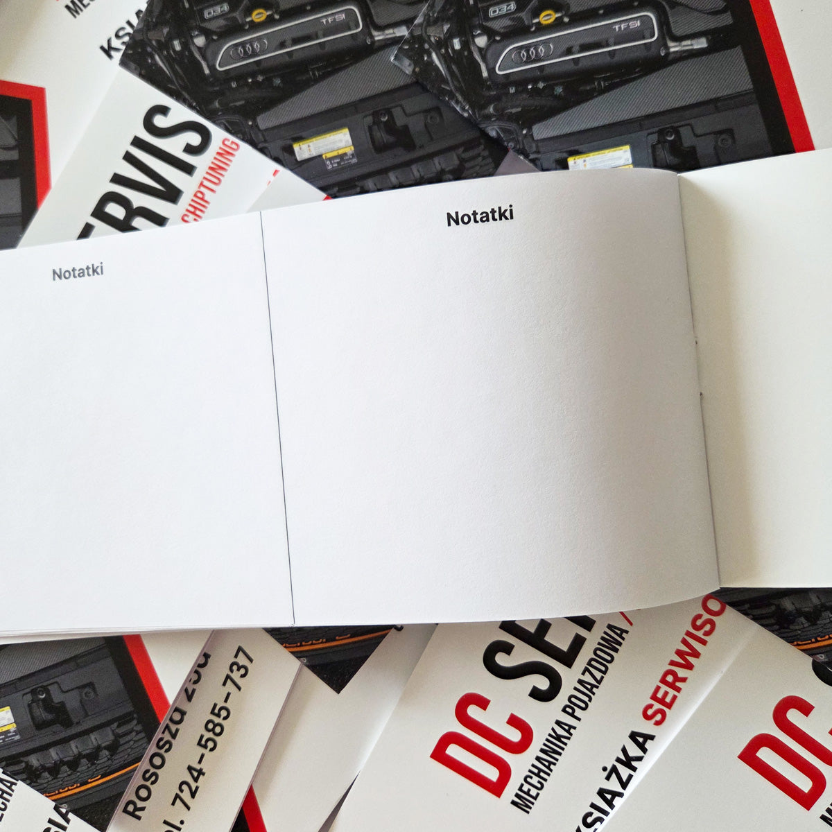 Książki serwisowe z logo